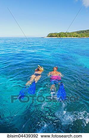 Couple snorkelling, Drawaqa Island, Yasawa, Fiji, Oceania View Large Photo Image Stock Image - Couple snorkelling, Drawaqa Island, Yasawa, Fiji, Oceania. Fotosearch