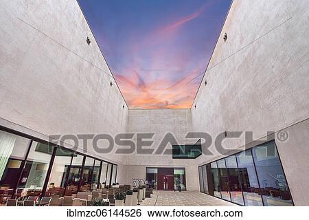 Stock Photograph - Courtyard in the evening of the new LWL, Museum of Art and Culture, Münster, North Rhine-Westphalia, Germany, Europe. Fotosearch