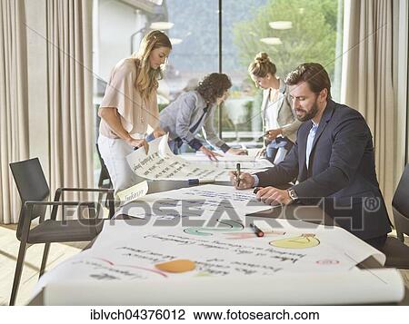 Creative teamwork, project work, workshop, training, seminar for executives, adult education, Austria, Europe View Large Photo Image Stock Image - Creative teamwork, project work, workshop, training, seminar for executives, adult education, Austria, Europe. Fotosearch