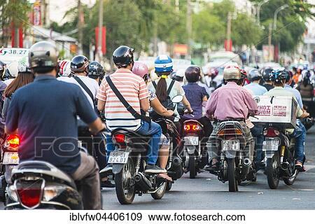 Crowd of scooter drivers in heavy traffic, Ho Chi Minh City, Vietnam, Asia View Large Photo Image Stock Photo - Crowd of scooter drivers in heavy traffic, Ho Chi Minh City, Vietnam, Asia. Fotosearch