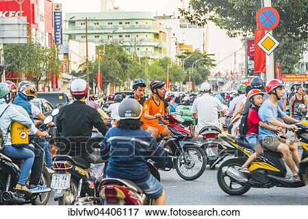 Crowd of scooter drivers in heavy traffic, Ho Chi Minh City, Vietnam, Asia View Large Photo Image Stock Photo - Crowd of scooter drivers in heavy traffic, Ho Chi Minh City, Vietnam, Asia. Fotosearch