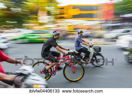 Cyclists and scooters in heavy traffic, motion blur, Ho Chi Minh City, Vietnam, Asia View Large Photo Image Stock Image - Cyclists and scooters in heavy traffic, motion blur, Ho Chi Minh City, Vietnam, Asia. Fotosearch