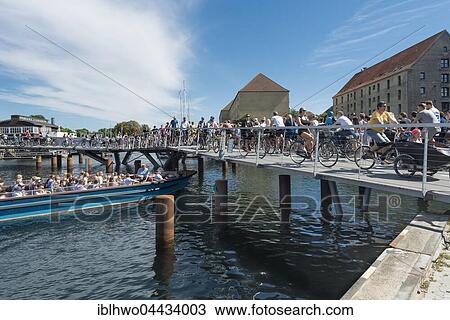 Stock Image - Cyclists, new bicycle and pedestrian bridge, inner harbour bridge, Butterfly Bridge, 3-way bridge, 2016, harbour, Copenhagen, Denmark, Europe. Fotosearch