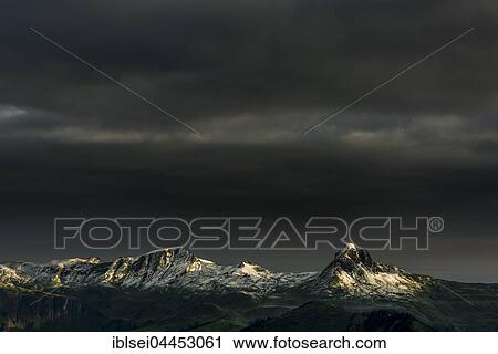 Stock Image - Damülser Horn, highest mountain in the Bregenz Forest Mountains, dark clouds and stormy atmosphere, Damüls, Vorarlberg, Austria, Europe. Fotosearch