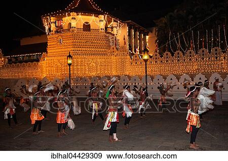 Stock Photo - Dance troupe, Kandy Dancers in traditional costumes, Esala Perahera Buddhist festival, Sri Dalada Maligawa or Temple of the Sacred Tooth Relic, Kandy, Central Province, Sri Lanka, Asia. Fotosearch