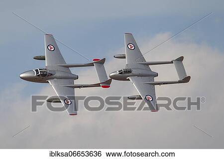 Stock Photograph - De Havilland Vampire two aircraft in flight in Royal Norwegian air force markings, Cambridgeshire, England, United Kingdom, Europe. Fotosearch