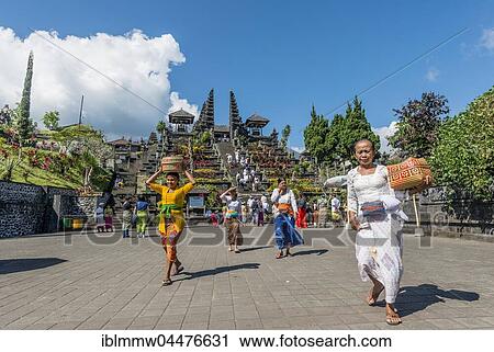 Stock Image - Devout Balinese, split gate, Candi bentar, mother temple Besakih, Pura Agung Besakih Penetaran, Banjar Besakih, Bali, Indonesia, Asia. Fotosearch