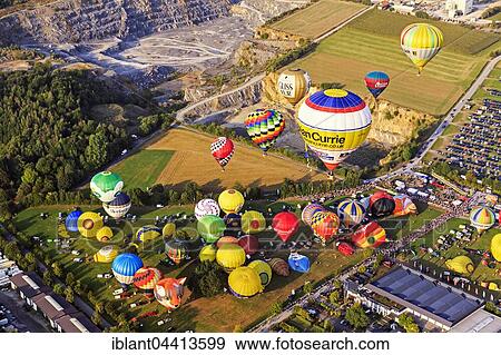 Different colored hot air balloons rising into the air, hot air balloon festival, 26th international Warsteiner Montgolfiade, Warstein, Sauerland, North Rhine-Westphalia, Germany, Europe View Large Photo Image Stock Photo - Different colored hot air balloons rising into the air, hot air balloon festival, 26th international Warsteiner Montgolfiade, Warstein, Sauerland, North Rhine-Westphalia, Germany, Europe. Fotosearch