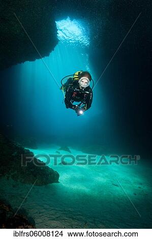 Diver in cave entrance, Cueva Luz, Cala Ratjada, Majorca, Balearic Islands, Spain, Europe View Large Photo Image Picture - Diver in cave entrance, Cueva Luz, Cala Ratjada, Majorca, Balearic Islands, Spain, Europe. Fotosearch