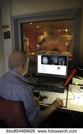 Stock Photograph - Doctor monitoring computer radiographs of MRI machine, Radiology, Children's Hospital, Hamburg, Germany, Europe. Fotosearch