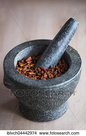 Dried red chillies, granite pestle and mortar View Large Photo Image Picture - Dried red chillies, granite pestle and mortar. Fotosearch