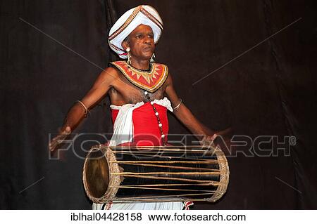 Stock Photo - Drummer in traditional costume, Kandy, Central Province, Sri Lanka, Asia. Fotosearch