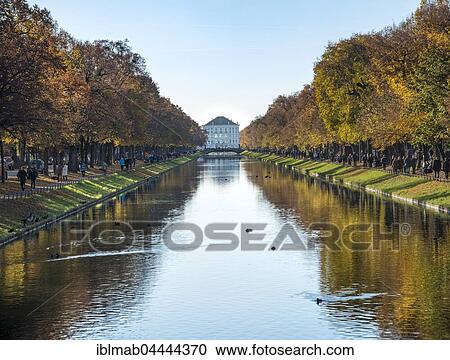 Stock Image - East side of Nymphenburg Palace in autumn with lock channel, Munich, Upper Bavaria, Bavaria, Germany, Europe. Fotosearch