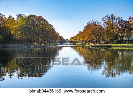 East side of Nymphenburg Palace with lock canal and bridge as seen from Hubertusbrunnen, autumn, Munich, Upper Bavaria, Bavaria, Germany, Europe View Large Photo Image Stock Photograph - East side of Nymphenburg Palace with lock canal and bridge as seen from Hubertusbrunnen, autumn, Munich, Upper Bavaria, Bavaria, Germany, Europe. Fotosearch