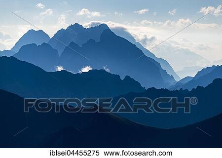 Ehrwald mountains in blue morning mist, Elemen, Lechtal, Bezirk Reutte, Tyrol, Austria, Europe View Large Photo Image Stock Photography - Ehrwald mountains in blue morning mist, Elemen, Lechtal, Bezirk Reutte, Tyrol, Austria, Europe. Fotosearch