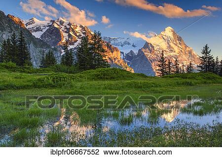 Stock Image - Eiger and mountain lake, Switzerland, Europe. Fotosearch