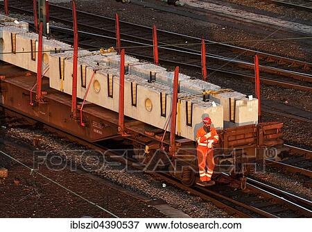 Employee on a moving freight train in the depot, Hagen, Ruhr District, North Rhine-Westphalia, Germany, Europe View Large Photo Image Stock Photo - Employee on a moving freight train in the depot, Hagen, Ruhr District, North Rhine-Westphalia, Germany, Europe. Fotosearch