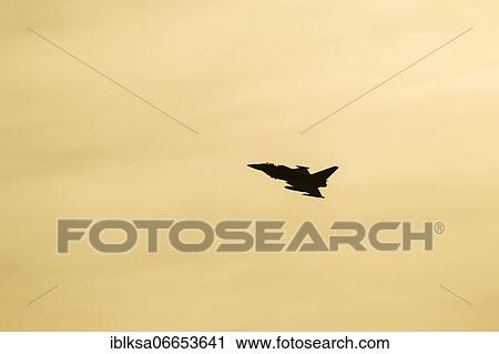 Eurofighter Typhoon aircraft in flight of the Royal air force at sunset, Lincolnshire, England, United Kingdom, Europe View Large Photo Image Stock Image - Eurofighter Typhoon aircraft in flight of the Royal air force at sunset, Lincolnshire, England, United Kingdom, Europe. Fotosearch
