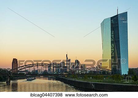 Stock Photo - European Central Bank at sunrise, in front of Frankfurt skyline, Frankfurt, Hesse, Germany, Europe. Fotosearch