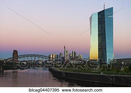 Stock Photography - European Central Bank at sunrise, in front of Frankfurt skyline, Frankfurt, Hesse, Germany, Europe. Fotosearch