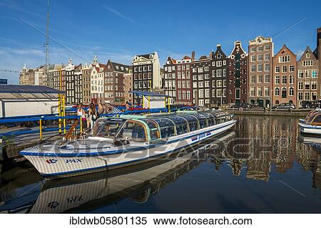 Excursion boat at the harbour, Damrak, Amsterdam, Province of North Holland, Netherlands, Amsterdam, Province of North Holland, Netherlands View Large Photo Image Stock Photography - Excursion boat at the harbour, Damrak, Amsterdam, Province of North Holland, Netherlands, Amsterdam, Province of North Holland, Netherlands. Fotosearch