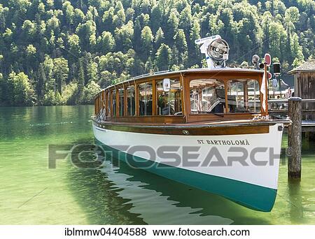Excursion boat beside jetty, Schönau am Königssee, Berchtesgaden National Park, Berchtesgaden area, Upper Bavaria, Bavaria, Germany, Europe View Large Photo Image Stock Photo - Excursion boat beside jetty, Schönau am Königssee, Berchtesgaden National Park, Berchtesgaden area, Upper Bavaria, Bavaria, Germany, Europe. Fotosearch