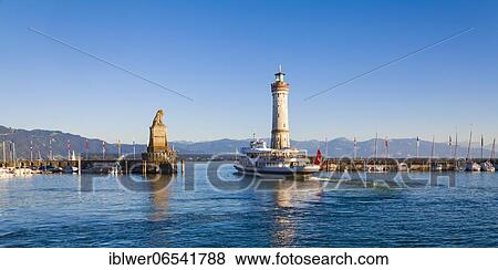 Excursion boat in the harbour entrance, Bavarian Lion, lighthouse, harbour, Lindau, Lake Constance, Bavaria, Germany, Europe View Large Photo Image Stock Photo - Excursion boat in the harbour entrance, Bavarian Lion, lighthouse, harbour, Lindau, Lake Constance, Bavaria, Germany, Europe. Fotosearch