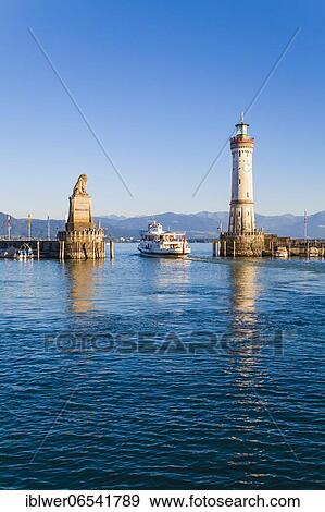 Excursion boat in the harbour entrance, Bavarian Lion, lighthouse, harbour, Lindau, Lake Constance, Bavaria, Germany, Europe View Large Photo Image Stock Photo - Excursion boat in the harbour entrance, Bavarian Lion, lighthouse, harbour, Lindau, Lake Constance, Bavaria, Germany, Europe. Fotosearch