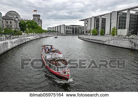 Excursion boat on the Spree, Reichstag building with waving German flag, Paul-Löbe-House and Elisabeth-Lüders-House, government district, Berlin, Germany, Europe View Large Photo Image Picture - Excursion boat on the Spree, Reichstag building with waving German flag, Paul-Löbe-House and Elisabeth-Lüders-House, government district, Berlin, Germany, Europe. Fotosearch