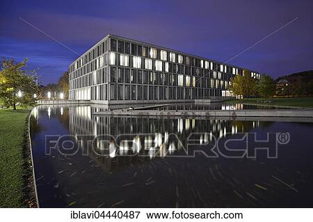 Stock Photo - Federal Labor Court, Bundesarbeitsgericht reflected in pond, night scene, Erfurt, Thuringia, Germany, Europe. Fotosearch