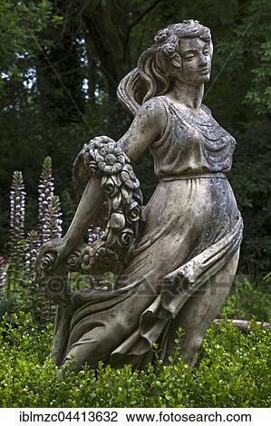 Female sculpture with a band of flowers behind acanthus (Acanthus), Parc Floral et Tropical de la Court d'Aron, Saint Cyr en Talmondais, Vandee, France, Europe View Large Photo Image Stock Image - Female sculpture with a band of flowers behind acanthus (Acanthus), Parc Floral et Tropical de la Court d'Aron, Saint Cyr en Talmondais, Vandee, France, Europe. Fotosearch