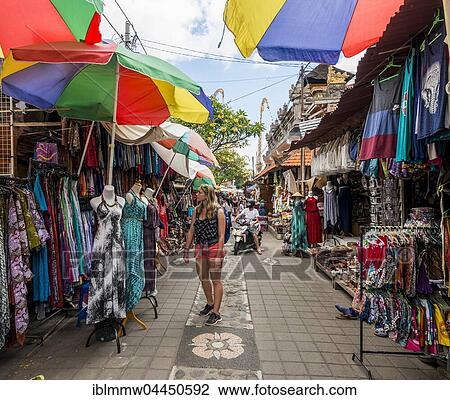 Female tourist looks at dresses, Traditional Art Market, Ubud, Bali, Indonesia, Asia View Large Photo Image Stock Image - Female tourist looks at dresses, Traditional Art Market, Ubud, Bali, Indonesia, Asia. Fotosearch
