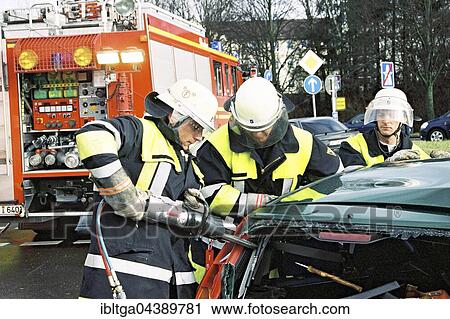 Firemen at traffic accident using Jaws of Life to rescue trapped car driver, Munich, Upper Bavaria, Bavaria, Germany, Europe View Large Photo Image Stock Image - Firemen at traffic accident using Jaws of Life to rescue trapped car driver, Munich, Upper Bavaria, Bavaria, Germany, Europe. Fotosearch