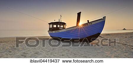 Fishing boat on beach at sunrise, Heringsdorf, Usedom, Mecklenburg-Western Pomerania, Germany, Europe View Large Photo Image Stock Photo - Fishing boat on beach at sunrise, Heringsdorf, Usedom, Mecklenburg-Western Pomerania, Germany, Europe. Fotosearch