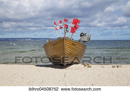 Stock Image - Fishing boat on sandy beach, Binz, Rügen, Germany, Europe. Fotosearch