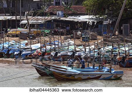 Stock Image - Fishing boats in harbor, Beruwela, Western Province, Sri Lanka, Asia. Fotosearch