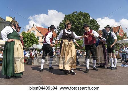Folk dance group dancing in traditional costumes, Lindau, Lake Constance, Bavaria, Germany, Europe View Large Photo Image Picture - Folk dance group dancing in traditional costumes, Lindau, Lake Constance, Bavaria, Germany, Europe. Fotosearch