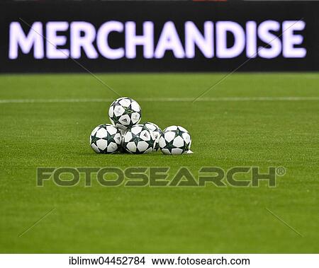 Picture - Footballs, match balls with Champions League Logo in front of perimeter advertisement, MERCHANDISE, Allianz Arena, Munich, Bavaria, Germany, Europe. Fotosearch