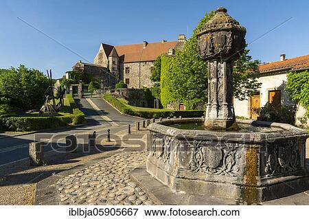 Fountain and the castle, Saint Saturnin, Puy de Dome department, Auvergne-Rhone-Alpes, France, Europe View Large Photo Image Stock Photo - Fountain and the castle, Saint Saturnin, Puy de Dome department, Auvergne-Rhone-Alpes, France, Europe. Fotosearch