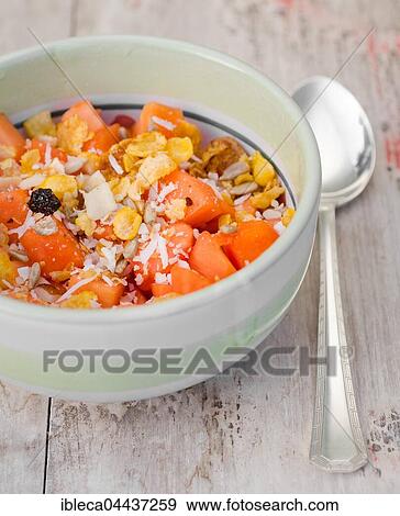 Fruit salad with papaya, granola and brazil nuts in a bowl View Large Photo Image Stock Photo - Fruit salad with papaya, granola and brazil nuts in a bowl. Fotosearch