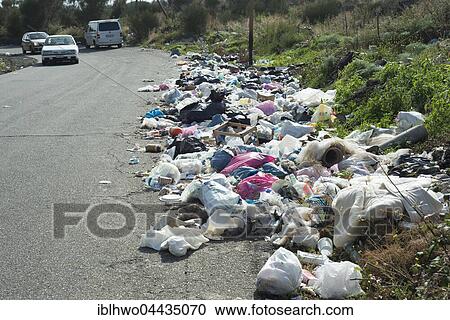Stock Image - Garbage on street, Adrano, Province of Catania, Sicily, Italy, Europe. Fotosearch