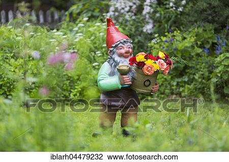 Garden gnome with flowerpot in garden, Baden-Wuerttemberg, Germany, Europe View Large Photo Image Stock Image - Garden gnome with flowerpot in garden, Baden-Wuerttemberg, Germany, Europe. Fotosearch