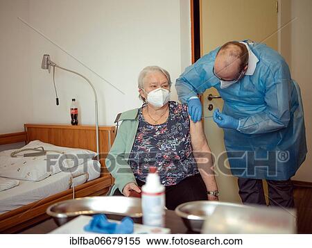 Gerlinde Haug, employee in senior care, she receives Corona vaccination, Vitanas senior residence, Miesbach, Bavaria, Germany, Europe View Large Photo Image Stock Photography - Gerlinde Haug, employee in senior care, she receives Corona vaccination, Vitanas senior residence, Miesbach, Bavaria, Germany, Europe. Fotosearch