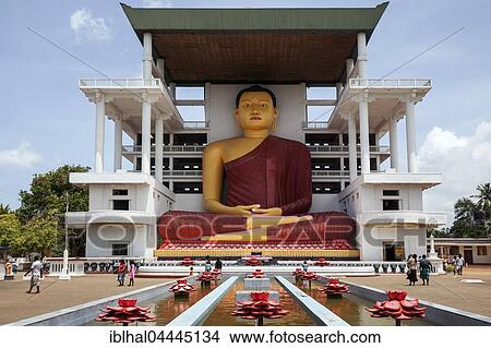 Giant Buddha statue, sitting Buddha fountain with artificial lotuses, Weherahena Temple, Matara, Southern Province, Sri Lanka, Asia View Large Photo Image Picture - Giant Buddha statue, sitting Buddha fountain with artificial lotuses, Weherahena Temple, Matara, Southern Province, Sri Lanka, Asia. Fotosearch