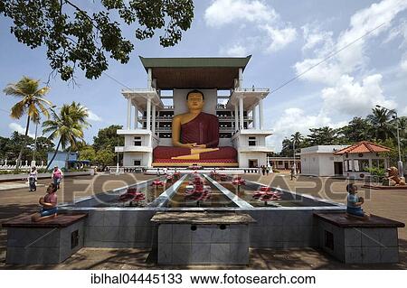Giant Buddha statue, sitting Buddha fountain with artificial lotuses, Weherahena Temple, Matara, Southern Province, Sri Lanka, Asia View Large Photo Image Stock Image - Giant Buddha statue, sitting Buddha fountain with artificial lotuses, Weherahena Temple, Matara, Southern Province, Sri Lanka, Asia. Fotosearch