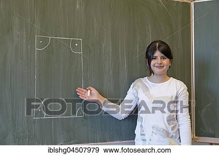 Girl at blackboard, drawn rectangle, elementary school, Germany, Europe View Large Photo Image Stock Photo - Girl at blackboard, drawn rectangle, elementary school, Germany, Europe. Fotosearch