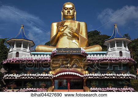Stock Image - Golden Buddha statue, golden temple, Rangiri Vihara, Dambulla, Central Province, Sri Lanka, Asia. Fotosearch