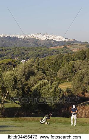 Golfer at golf course, Montenmedio Golf and Country Club, behind Vejer de la Frontera, Cadiz province, Andalusia, Spain, Europe View Large Photo Image Stock Image - Golfer at golf course, Montenmedio Golf and Country Club, behind Vejer de la Frontera, Cadiz province, Andalusia, Spain, Europe. Fotosearch
