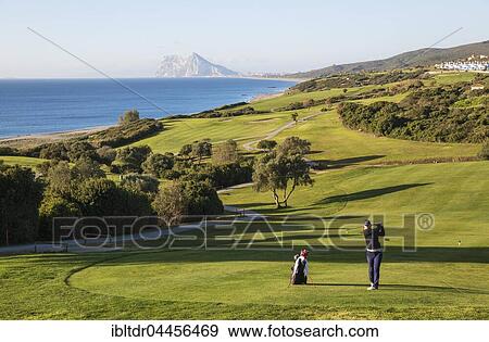 Golfer at La Alcaidesa Golf Resort with Mediterranean Sea and Rock of Gibraltar, Cádiz, Andalusia, Spain, Europe View Large Photo Image Stock Photo - Golfer at La Alcaidesa Golf Resort with Mediterranean Sea and Rock of Gibraltar, Cádiz, Andalusia, Spain, Europe. Fotosearch