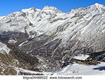 Gourmet Restaurant Spielboden in front of snowy peaks Fletschhorn, Lagginhorn and Weissmies, in the valley of Saas-Fee, Canton of Valais, Switzerland, Europe View Large Photo Image Stock Image - Gourmet Restaurant Spielboden in front of snowy peaks Fletschhorn, Lagginhorn and Weissmies, in the valley of Saas-Fee, Canton of Valais, Switzerland, Europe. Fotosearch